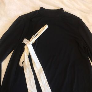 black mock neck sweater with tie